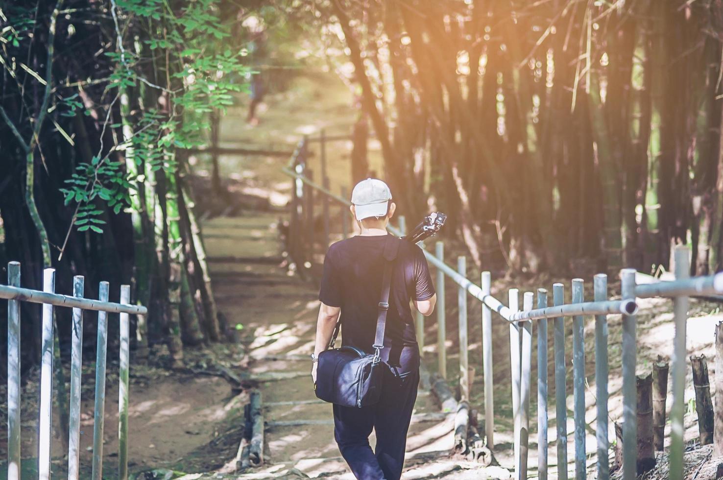 photographer traveling into the forest for beautiful forest pictures photo