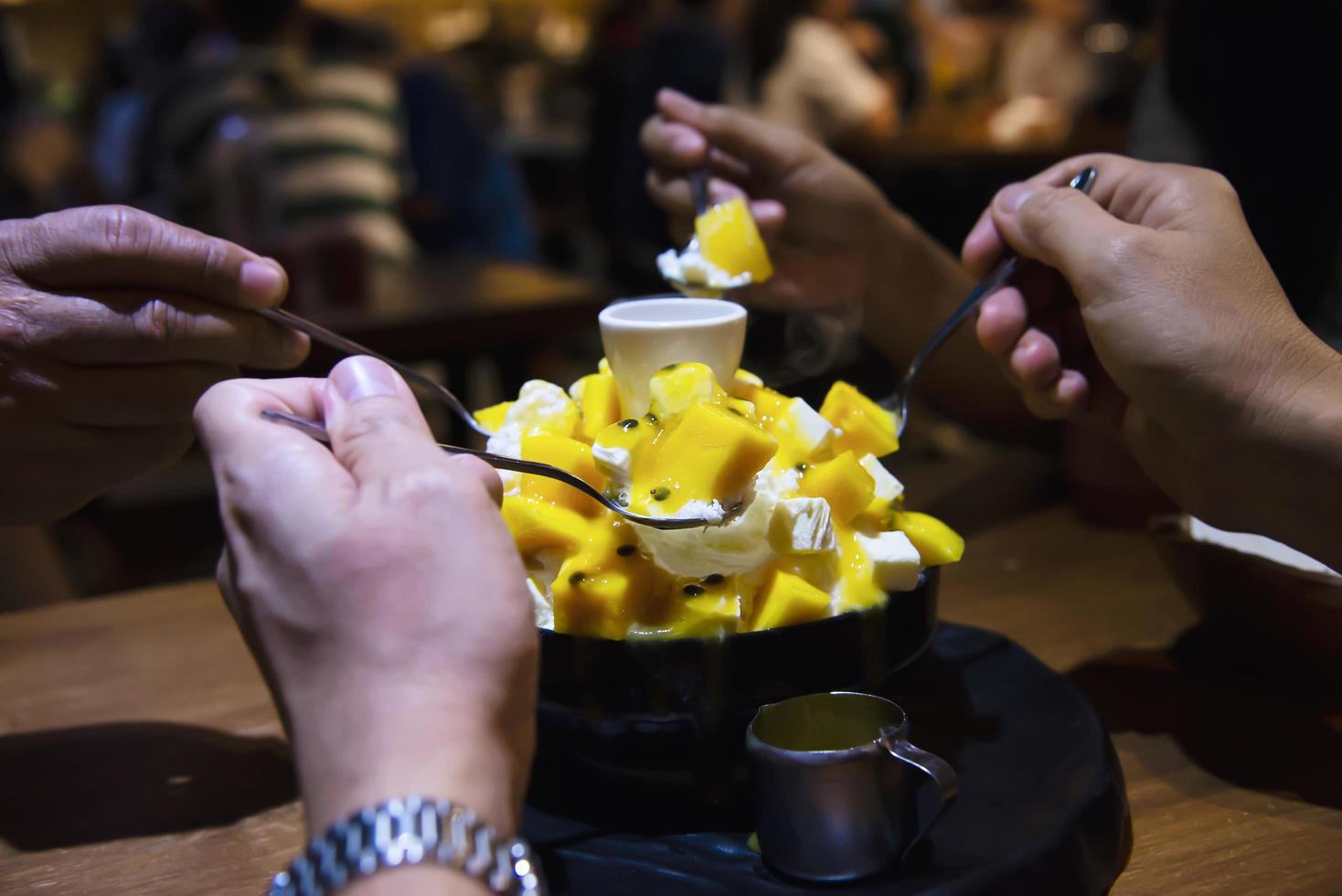 People eating bingsu sweet dessert - people with Korean style sweet dessert for background use photo