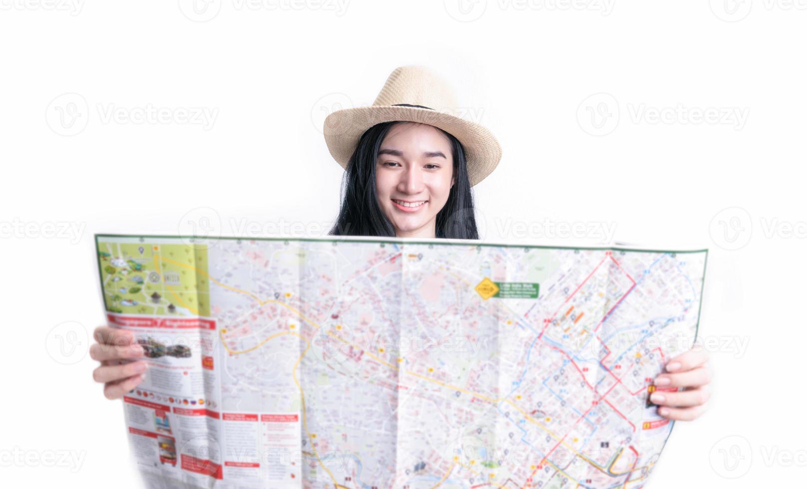 Woman holding map for planning travel on holiday photo