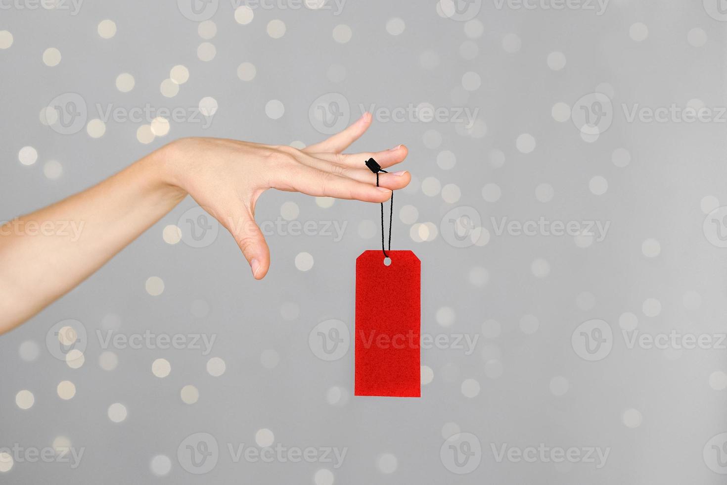 Hand with price tag photo