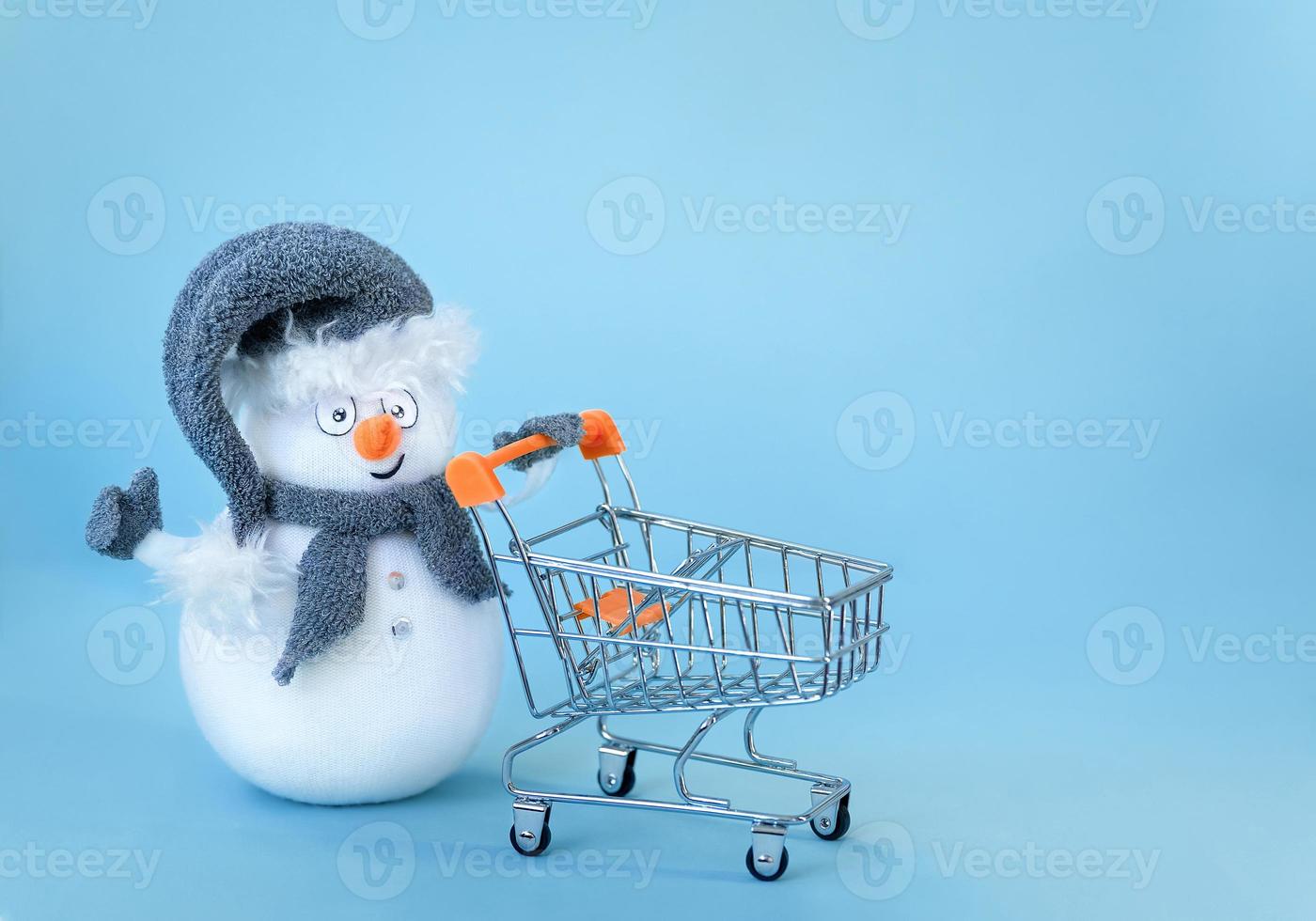 Snowman  with shopping cart photo
