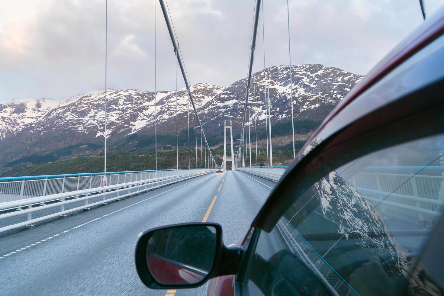 Driving on the Norway, road trip journey, travelling by car. Moving on the bridge. photo