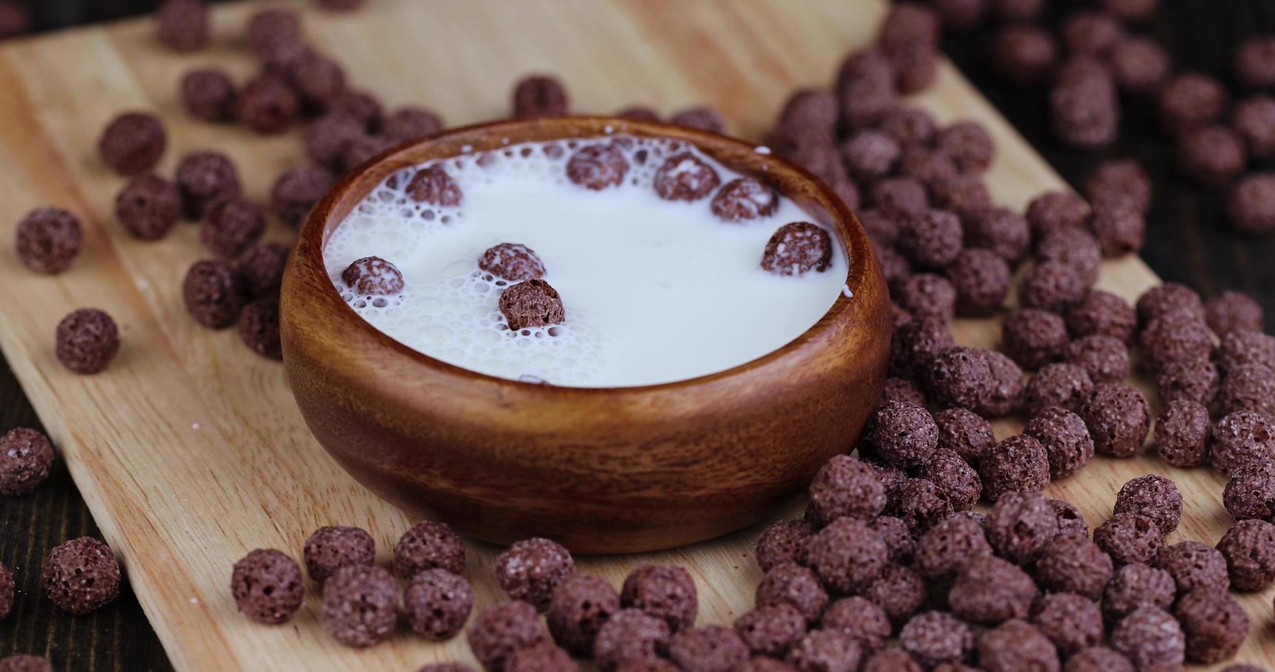 throw and drop chocolate balls into milk photo