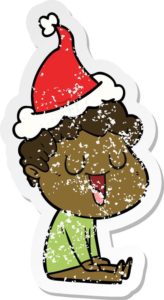 laughing distressed sticker cartoon of a man wearing santa hat vector