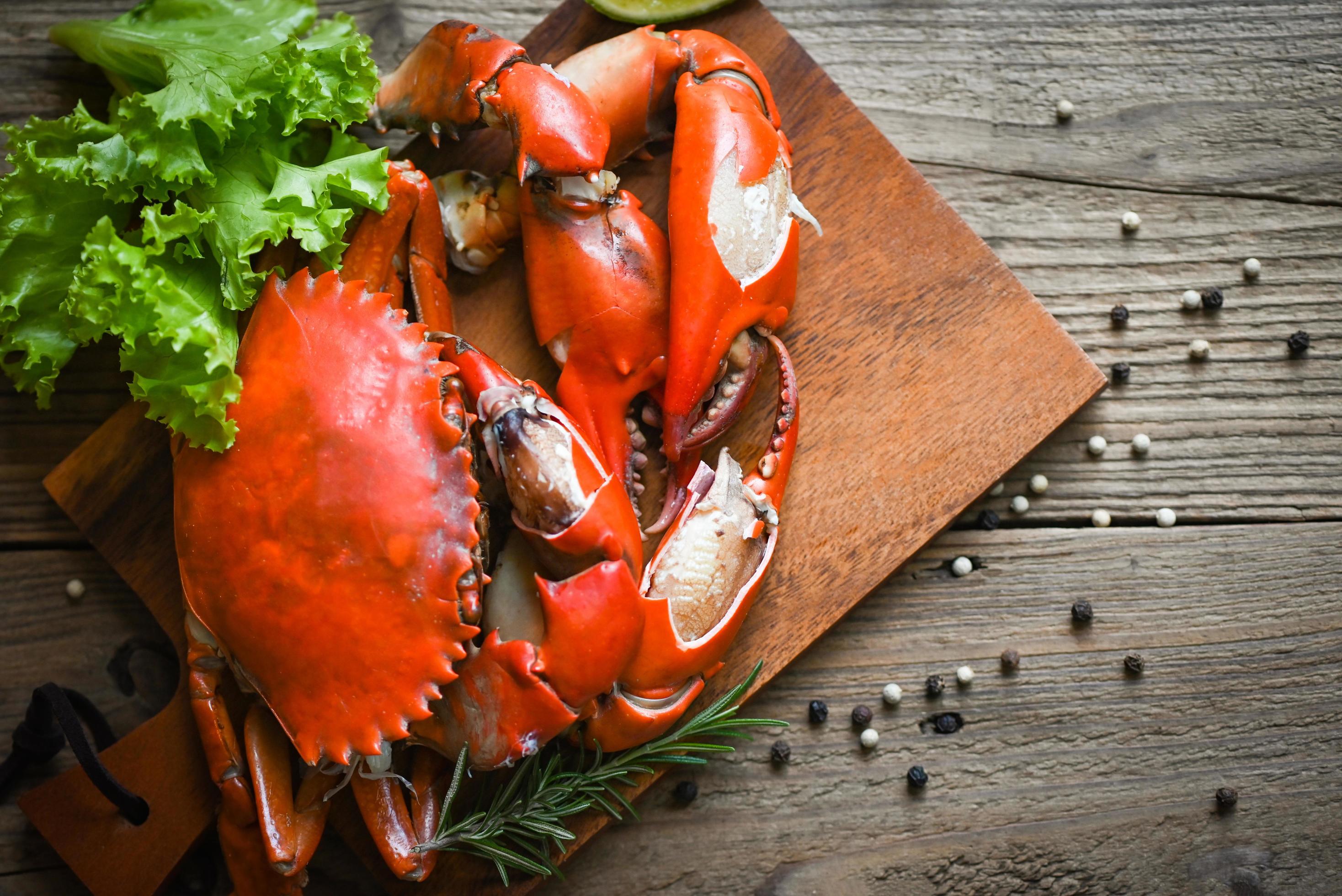 Fresh crab on wooden plate, boiled or steamed crab red in the