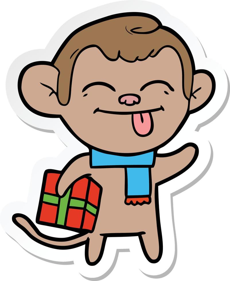 pegatina de un divertido mono de dibujos animados con regalo de navidad vector