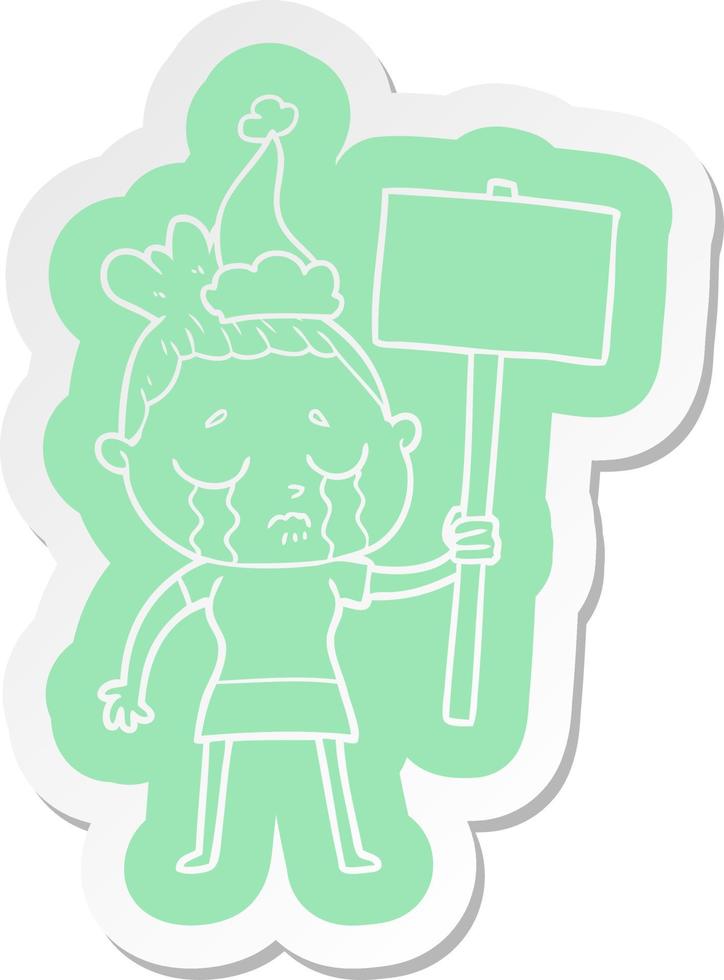 cartoon  sticker of a crying woman with protest sign wearing santa hat vector