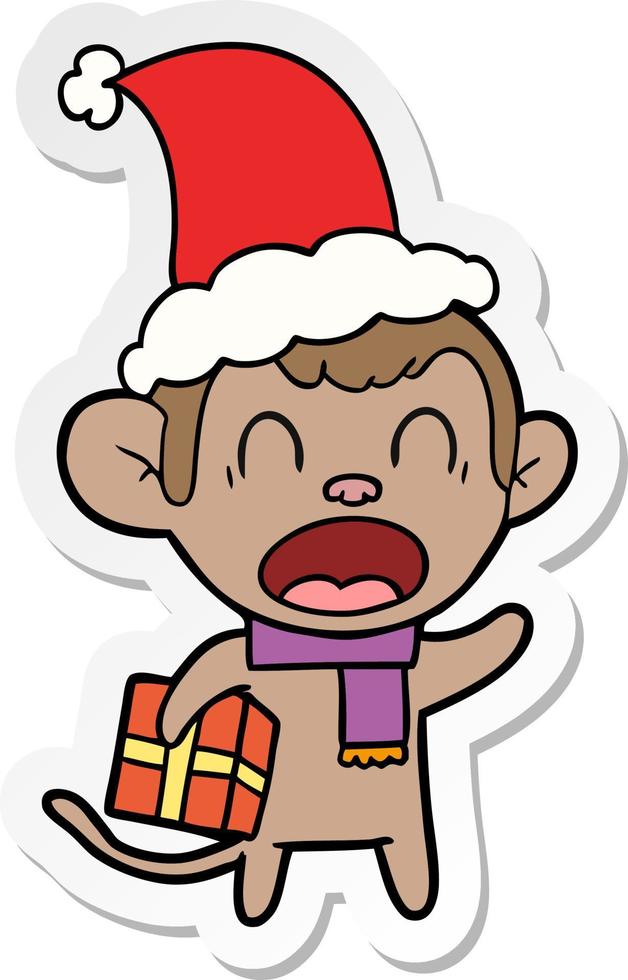 shouting sticker cartoon of a monkey carrying christmas gift wearing santa hat vector