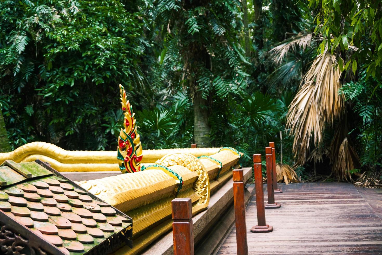 serpent tail statue in the temple photo
