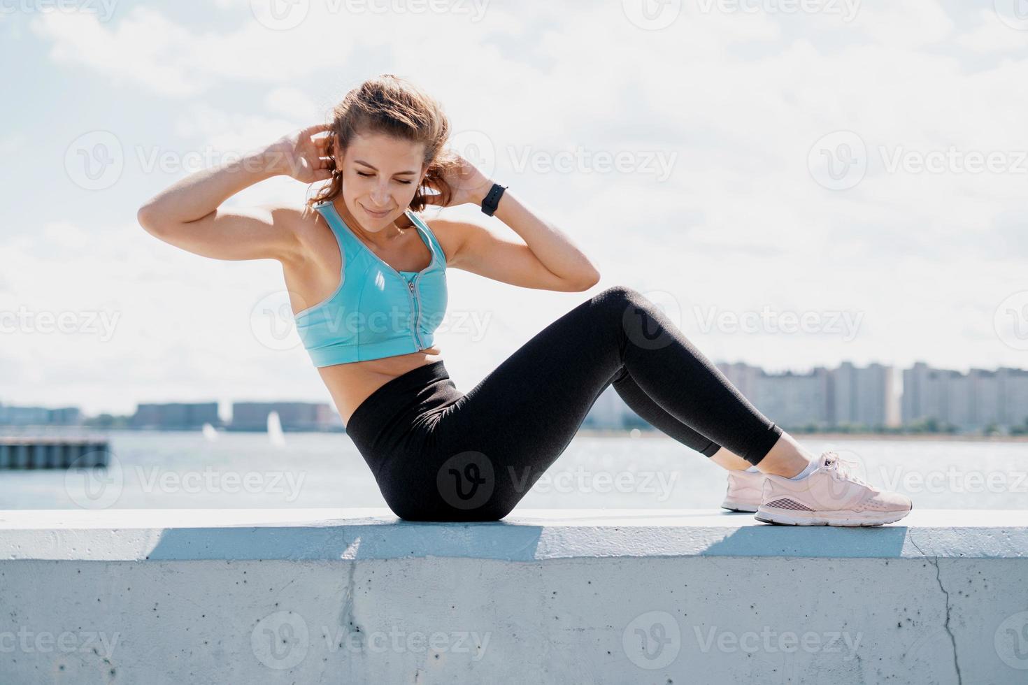 Doing exercises sports fitness young woman photo