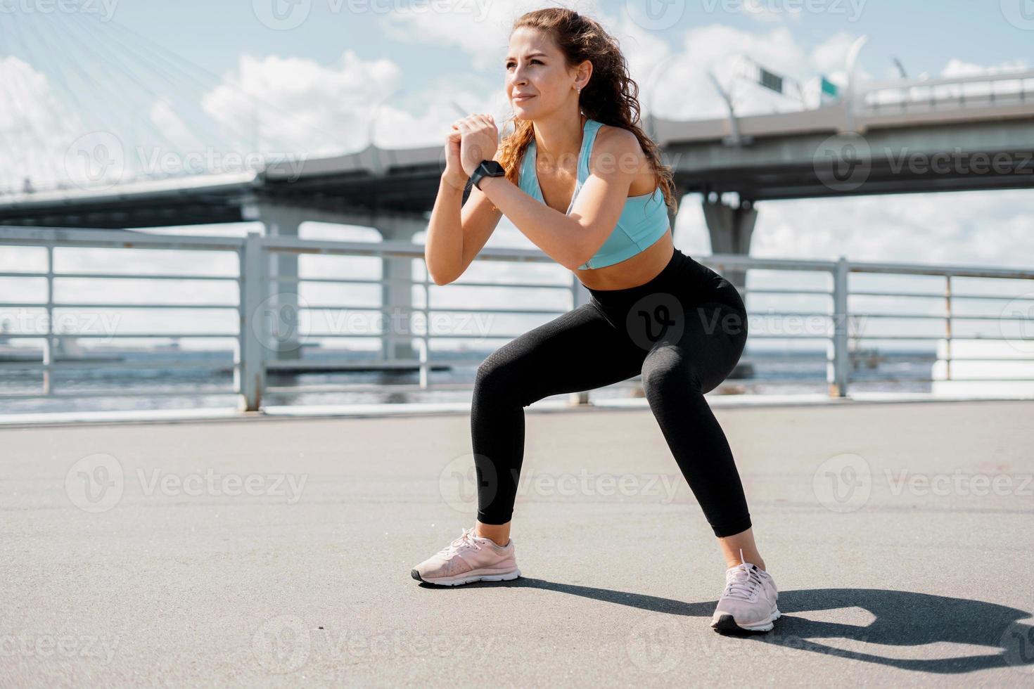 Doing exercises sports fitness young woman photo