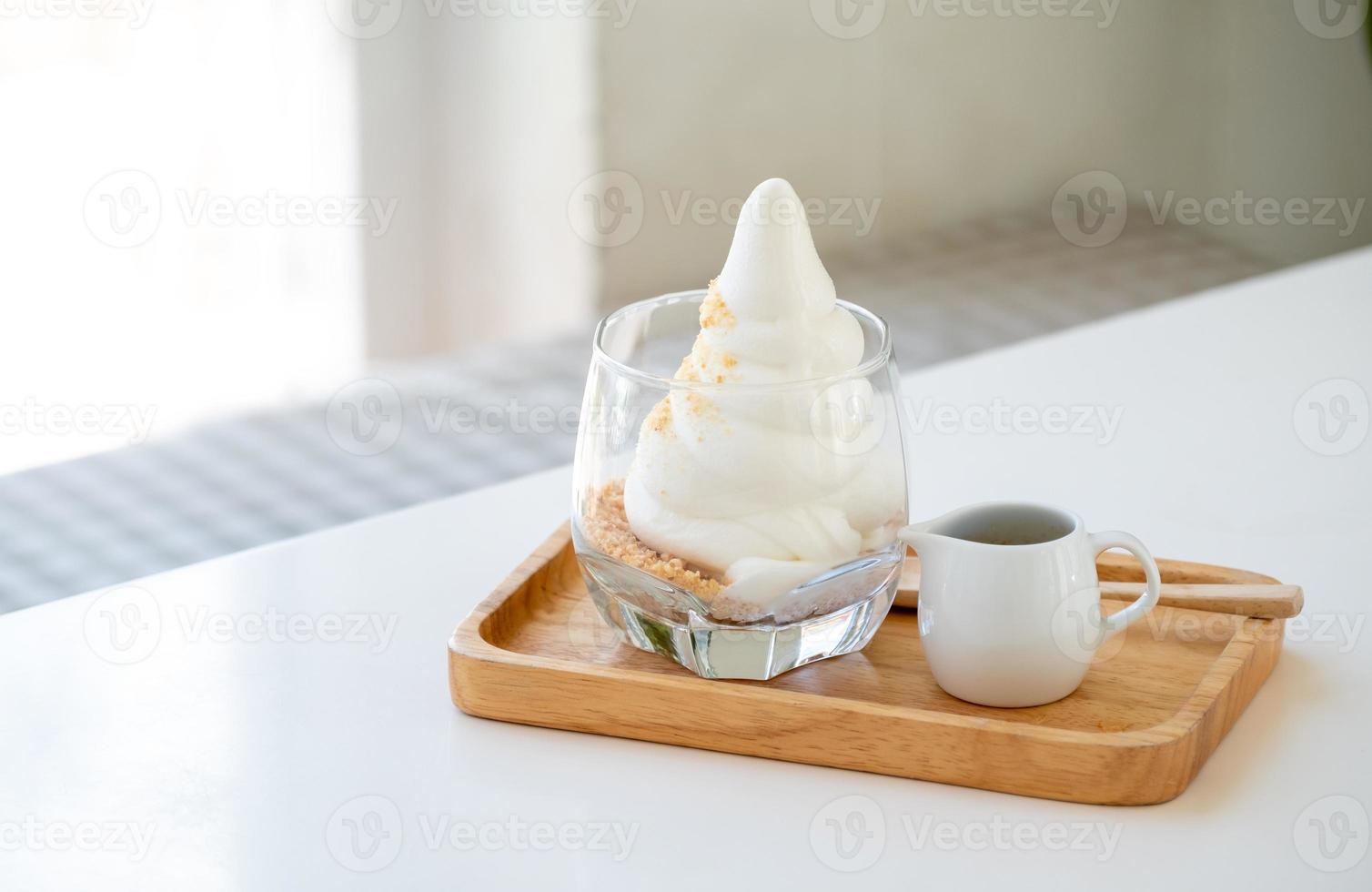 Affogato Espresso on wooden disk on the white table near windows in coffee shop, ice cream, cafe, copy space photo