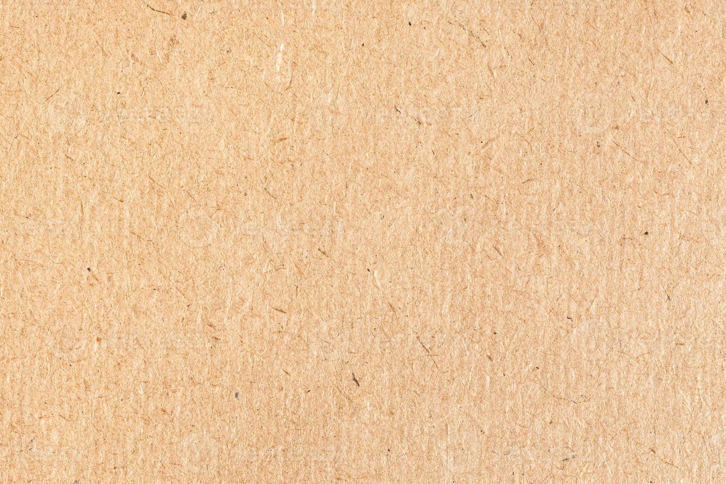 textured surface of old brown cardboard close up photo