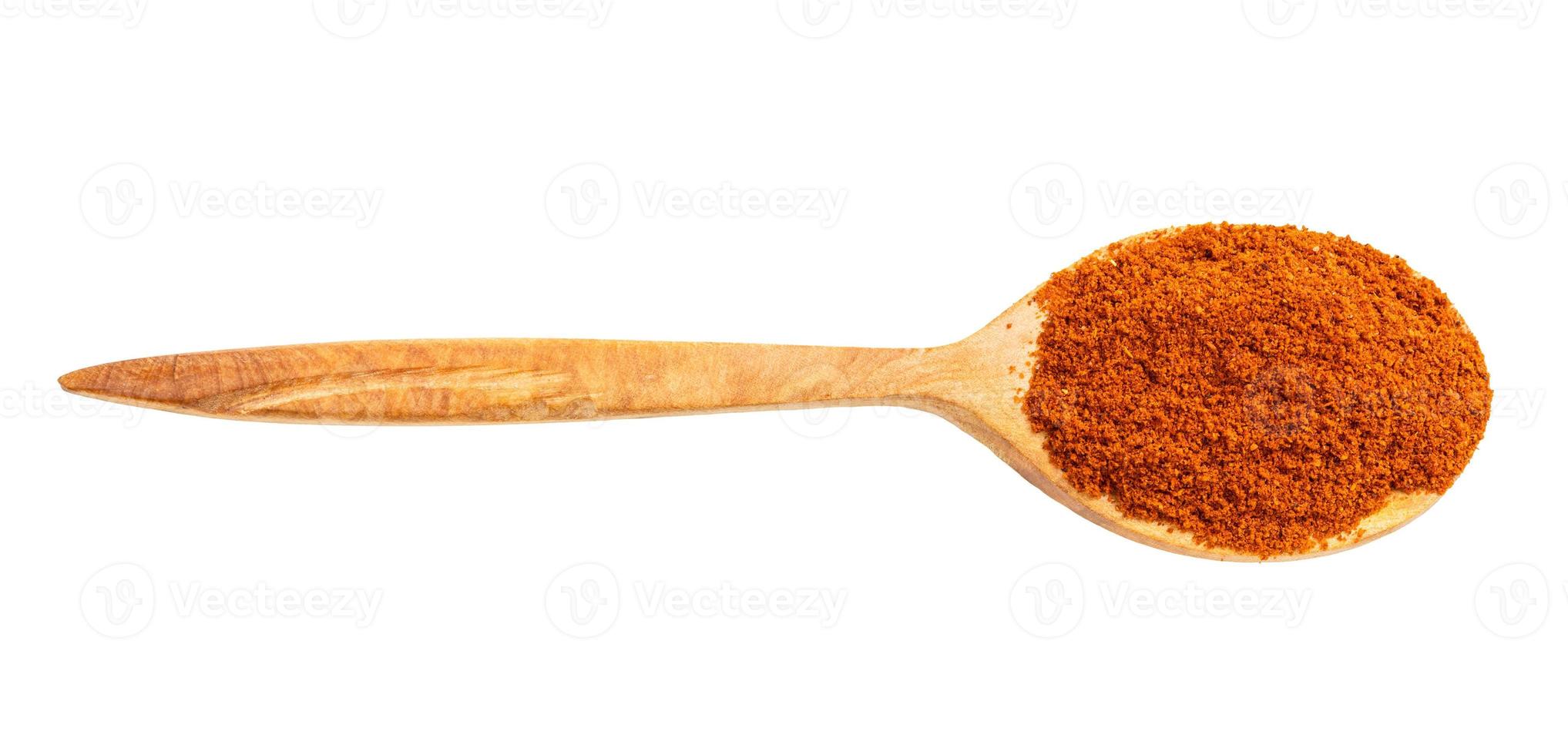 view of wood spoon with chili powder from cayenne photo