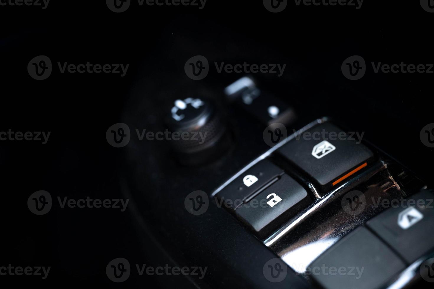 In-vehicle control buttons, mirror locks, car door locks, are installed on the side of the driver's side door. to control the safety of using the car photo