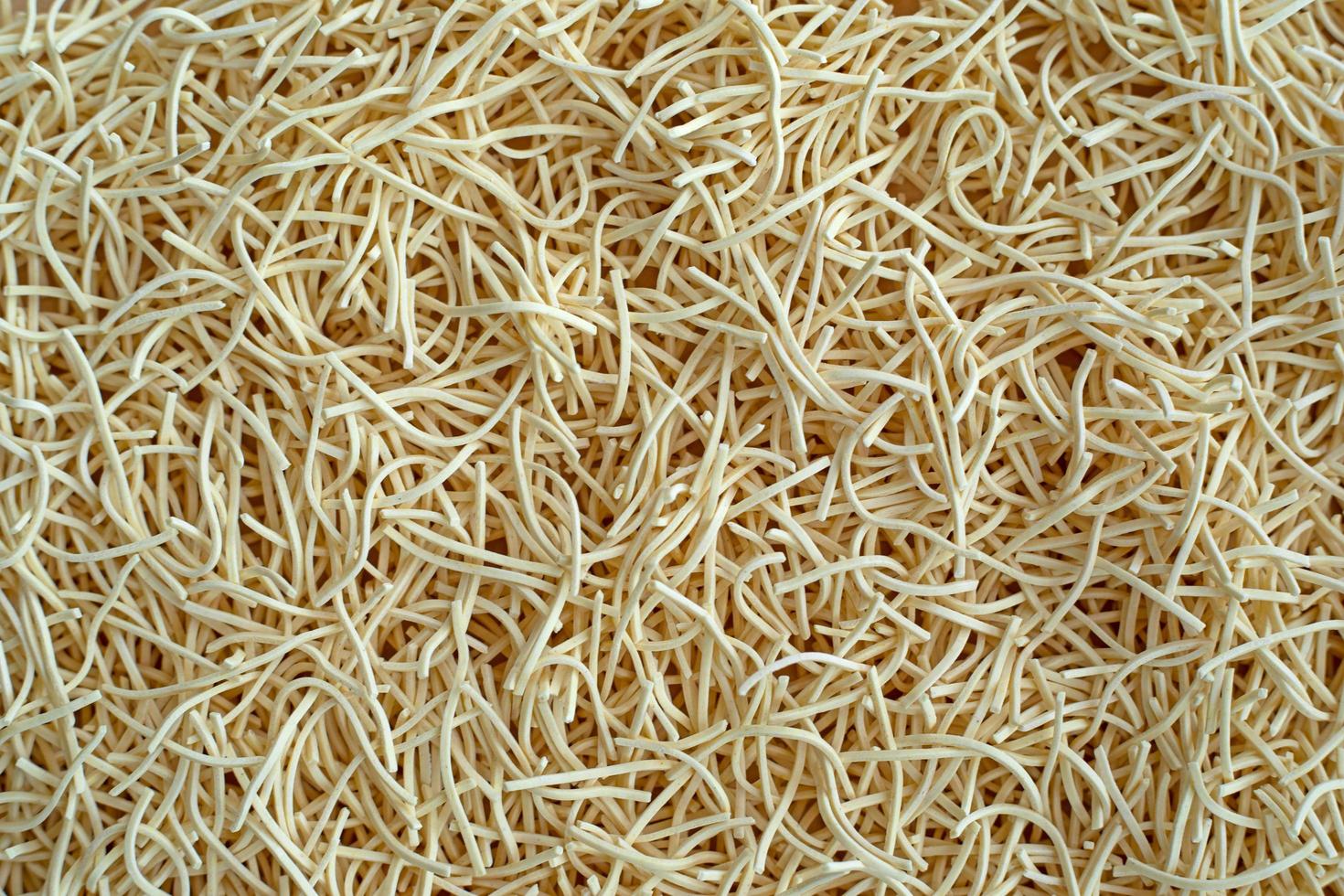 Thin egg noodles for broth background texture photo