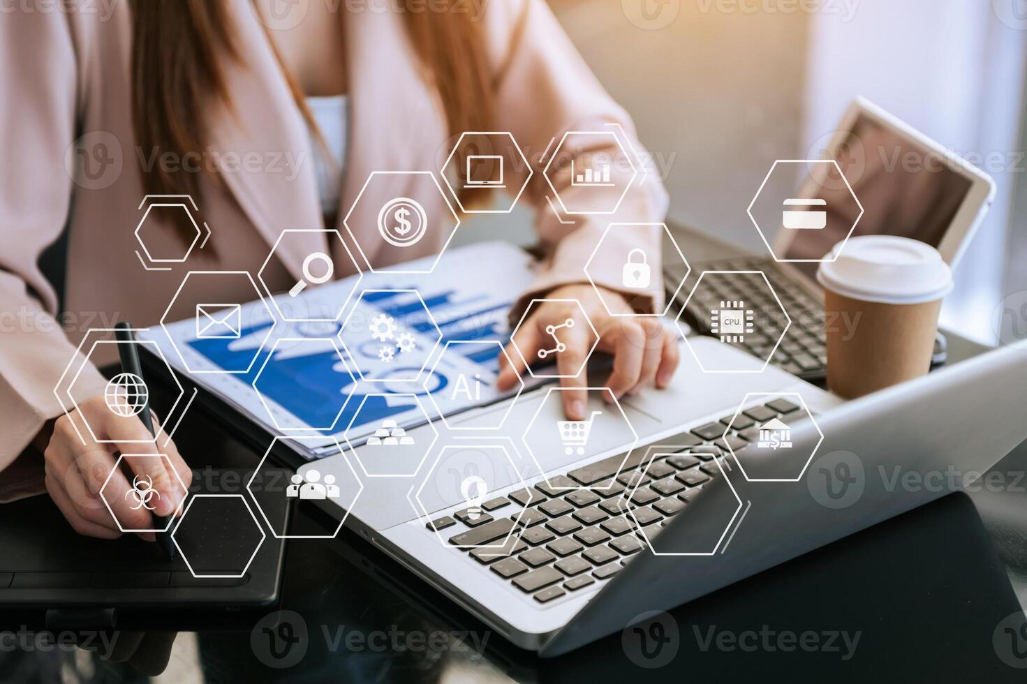 Designer using mobile phone with laptop and digital tablet laptop photo