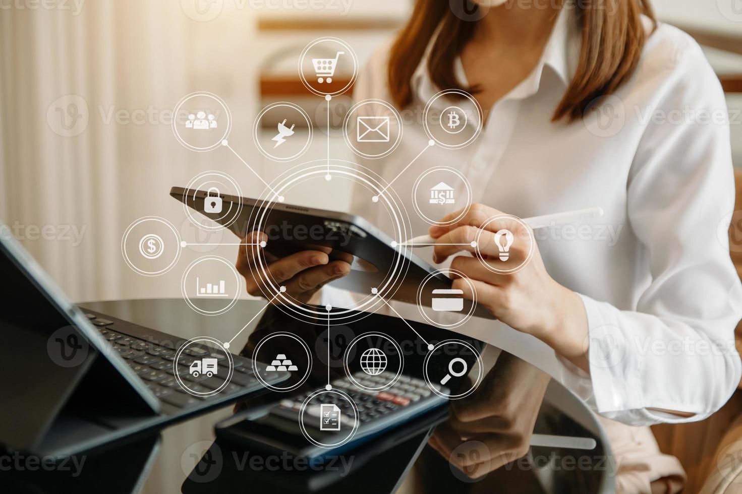 Businesswoman working with smart phone and laptop and digital tablet computer in office with digital marketing media in virtual icon photo