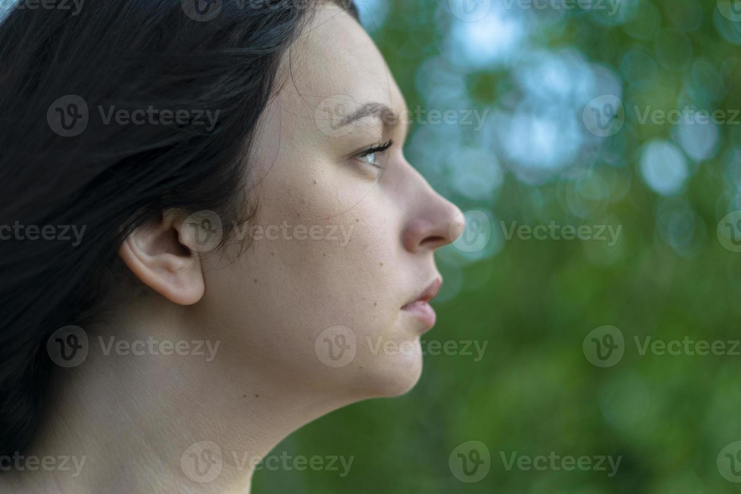 Close up retro portrait of a young Caucasian girl. photo