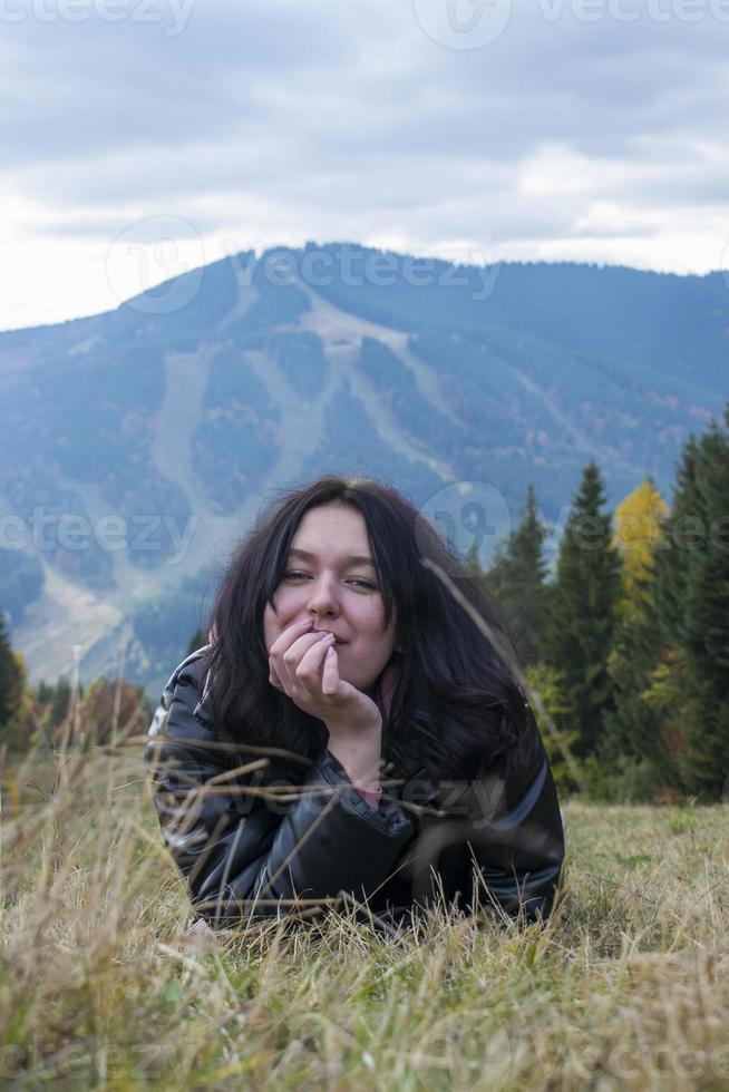 Portrait of happy cheerful beautiful young woman, outdoors. photo