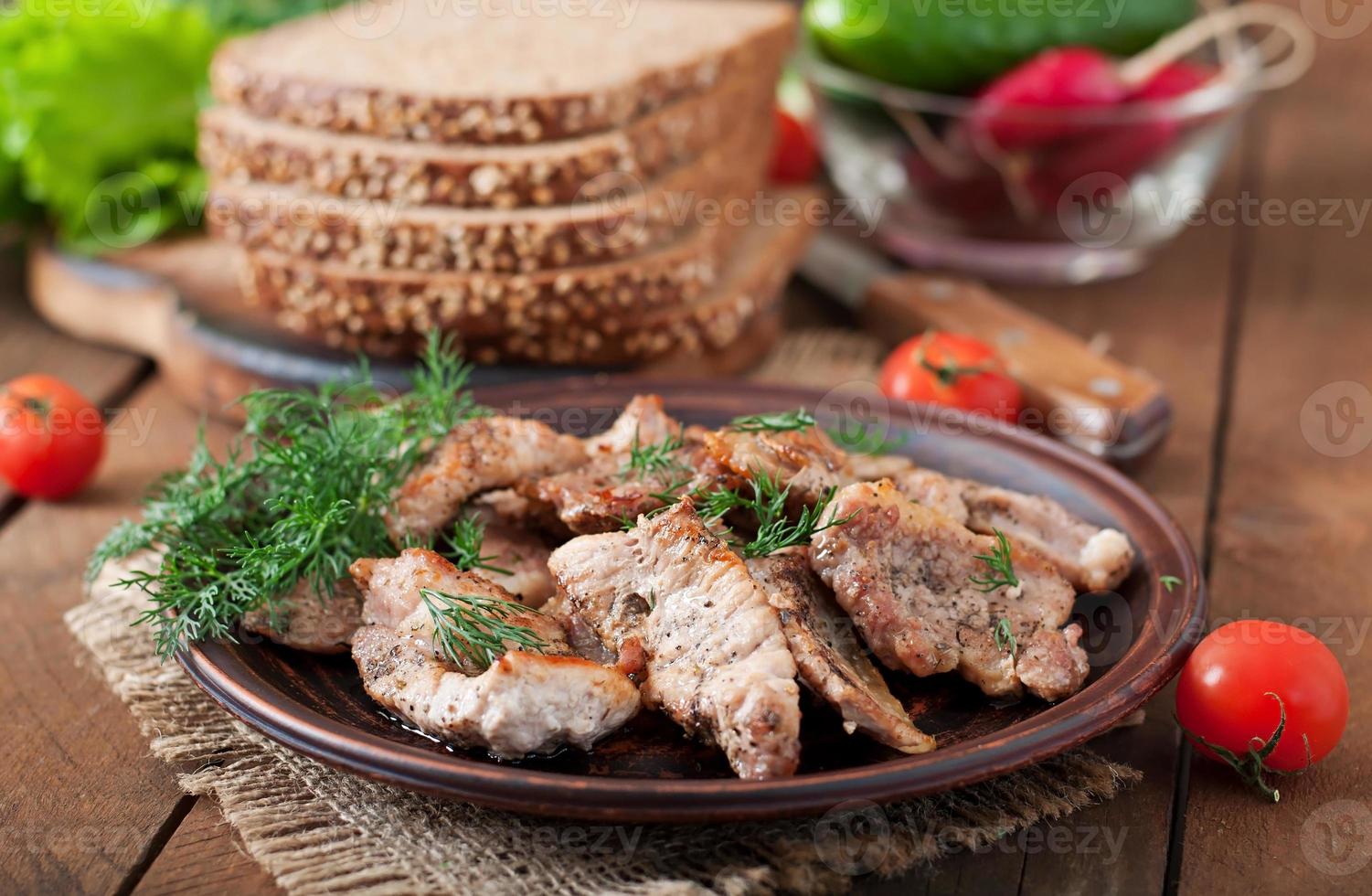 Fried pieces meat and rye bread for sandwiches photo