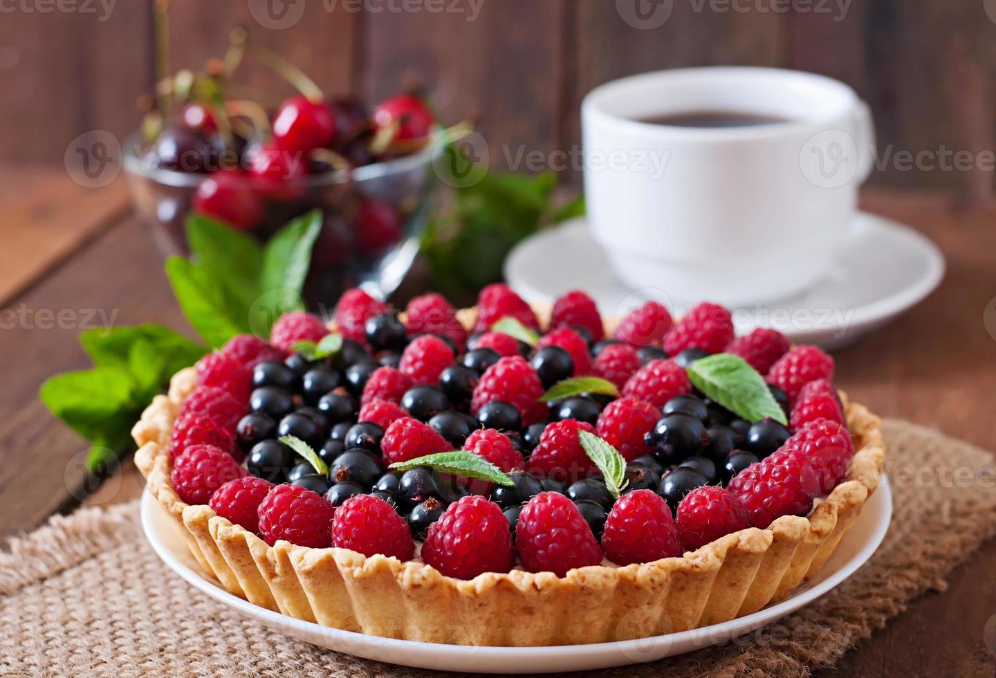 Tart with berries and custard photo