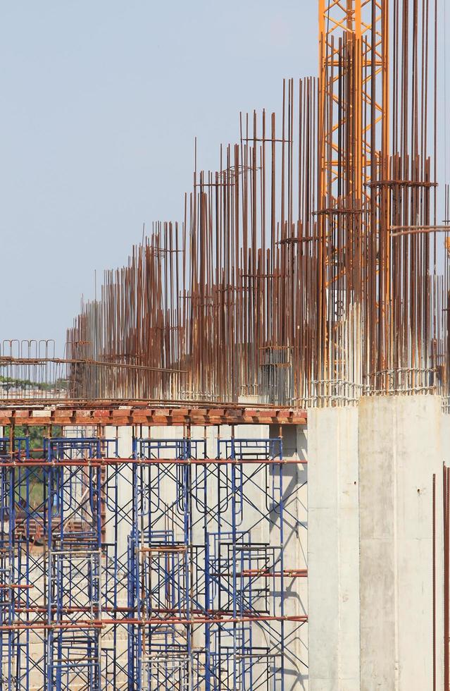 Construction site with enforced concrete steel frames rising up photo