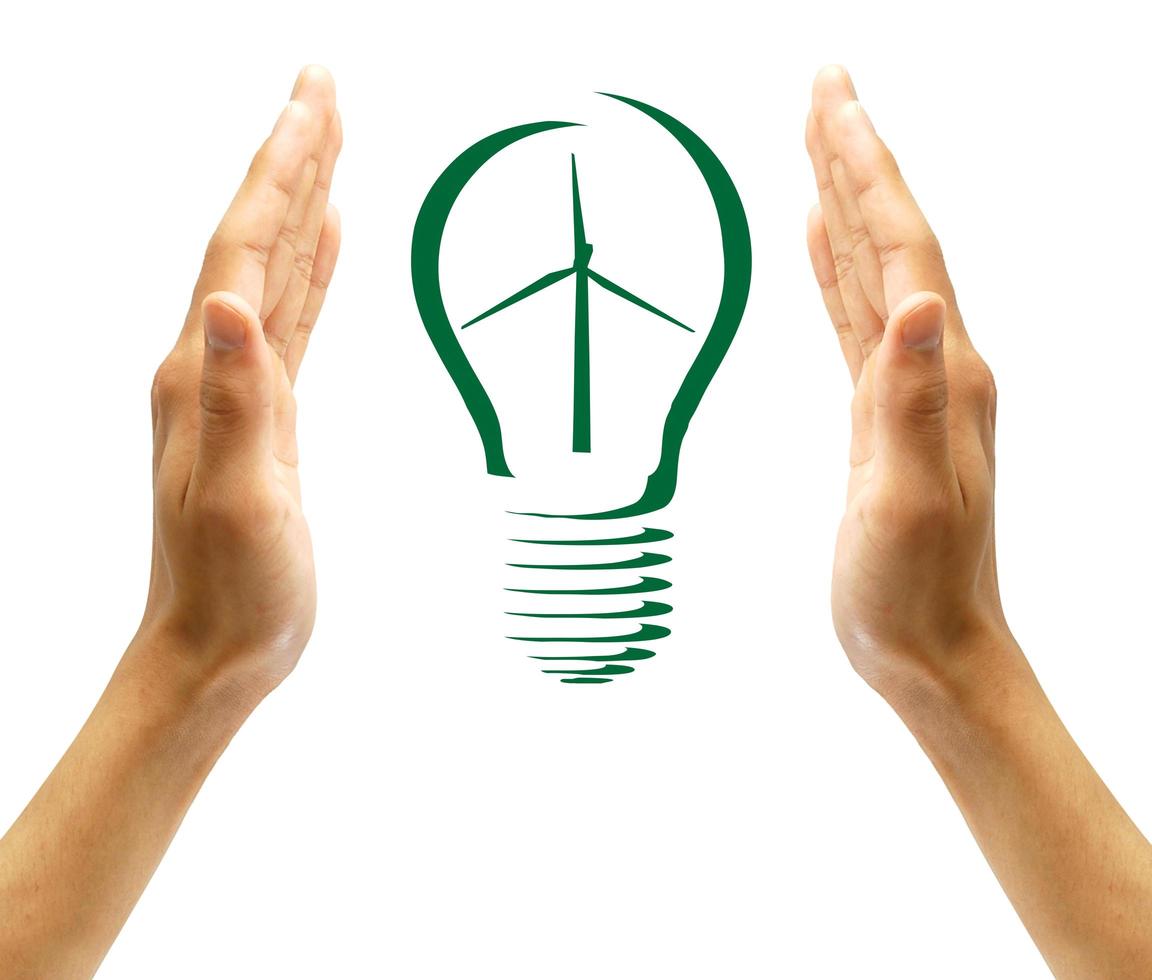 Concept Wind turbine  in light bulb symbol of renewable energy photo