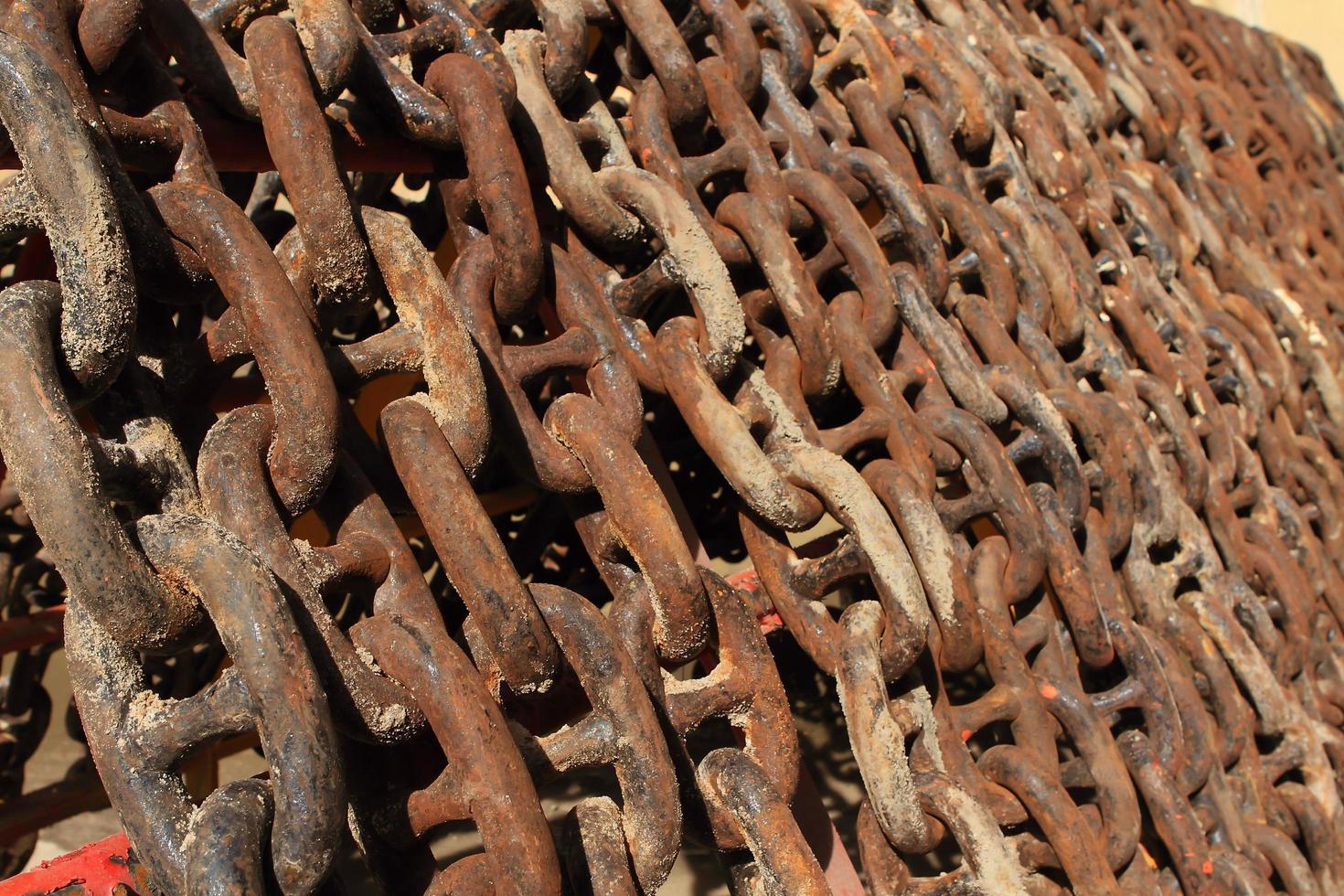 Old rusty ship anchor chain links close up. photo