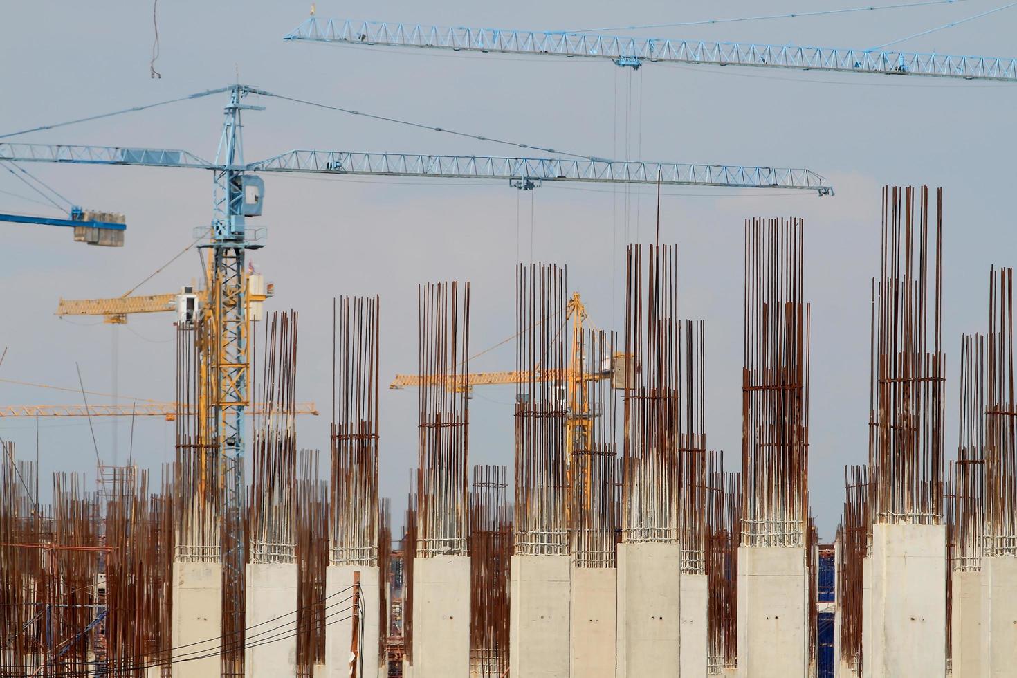 Construction site with enforced concrete steel frames rising up photo