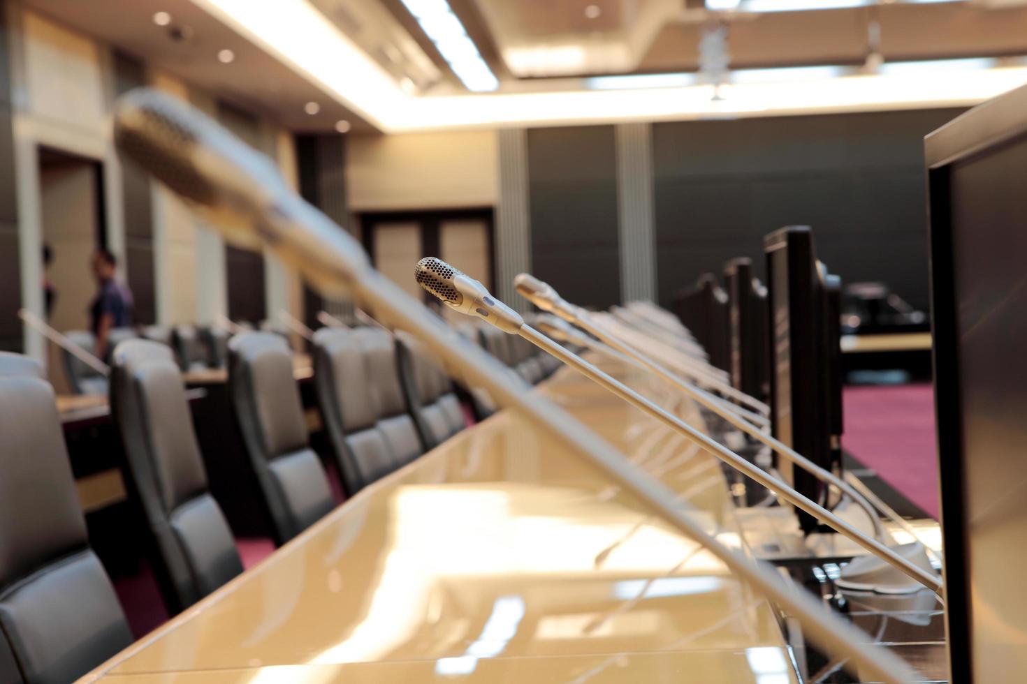 the microphones in front of empty chairs photo