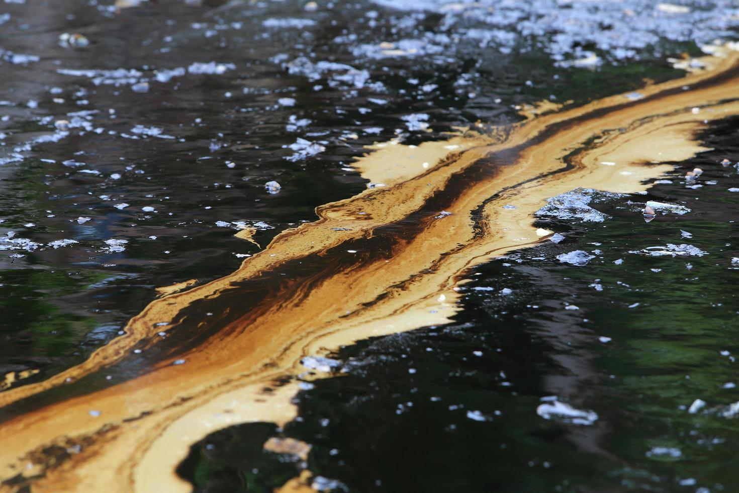 Gulf oil spill is shown on a beach photo