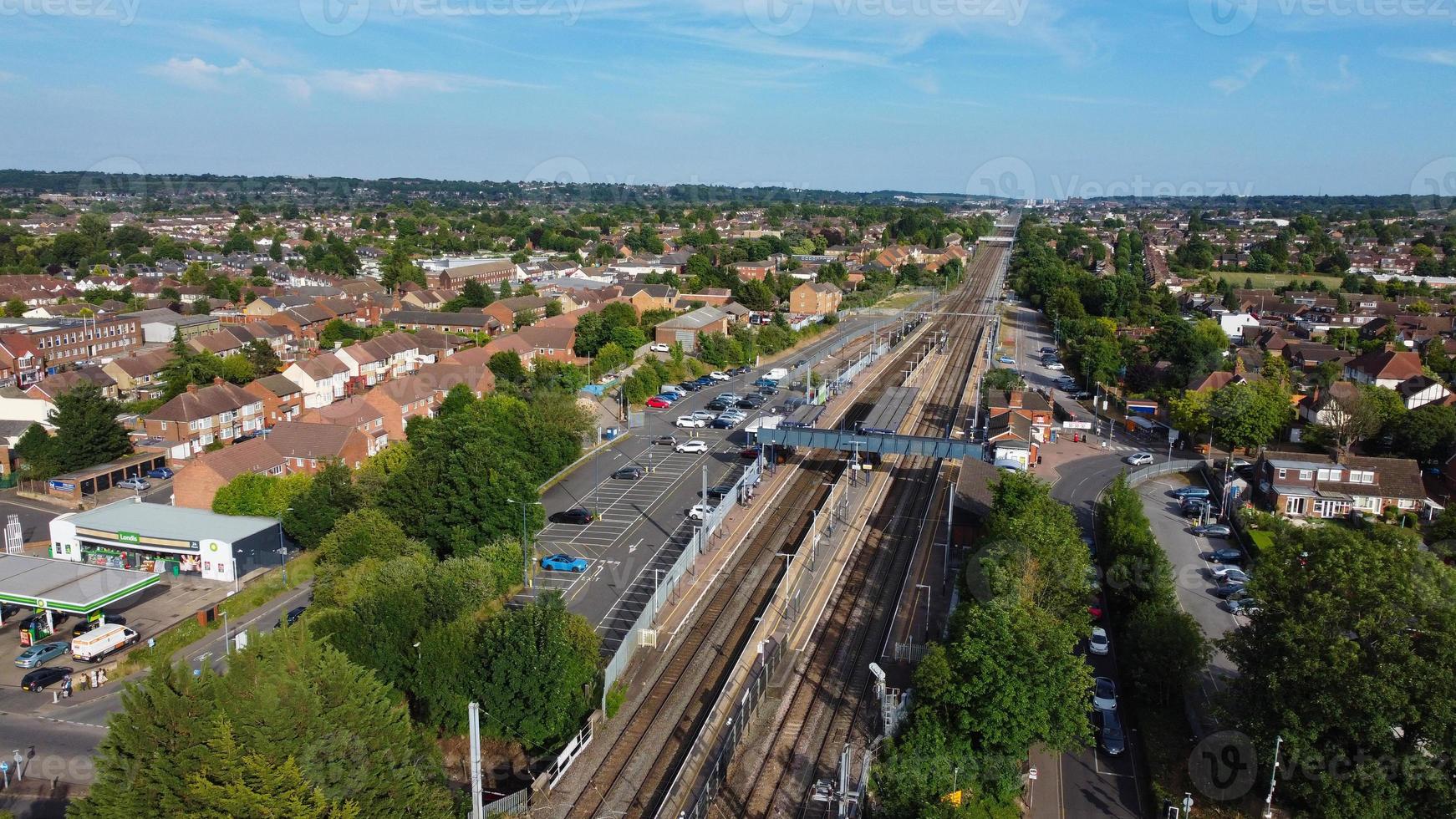 Aerial view of Luton Town with High Angle Footage of Train and Track Passing through city of England UK photo
