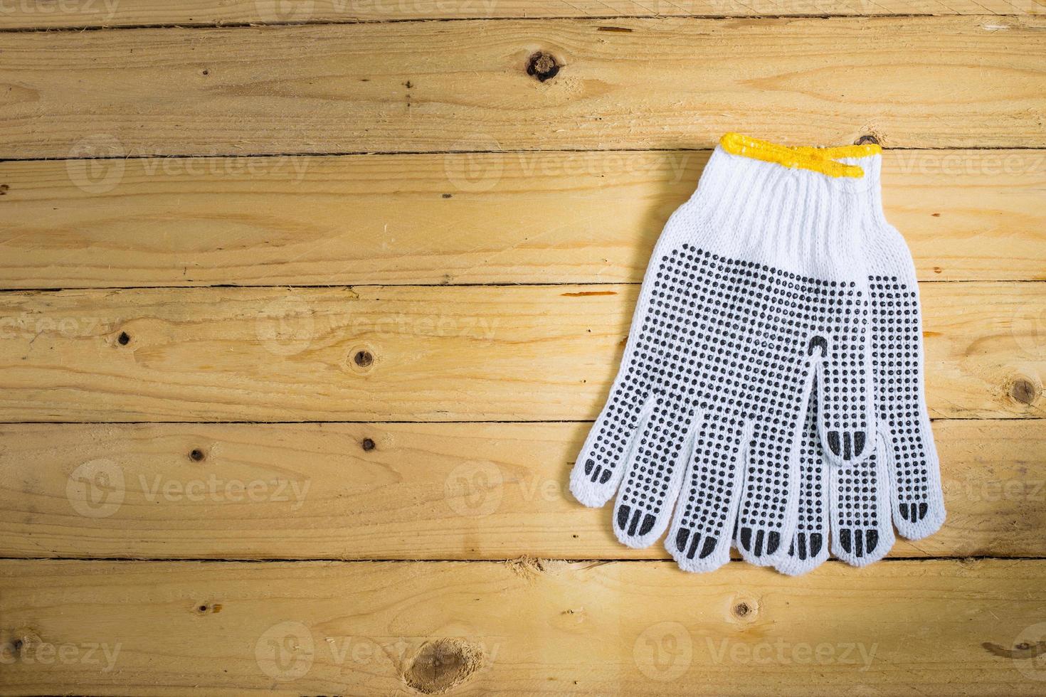 Gloves on wooden background photo