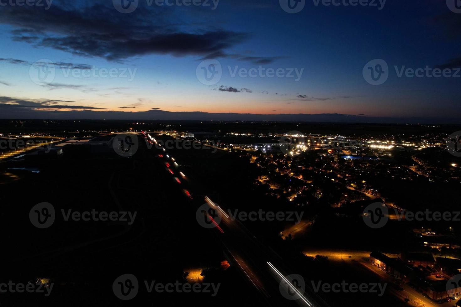 Beautiful Aerial High Angle View of British Motorways and Traffic at Luton Town of England UK at Night after Sunset photo