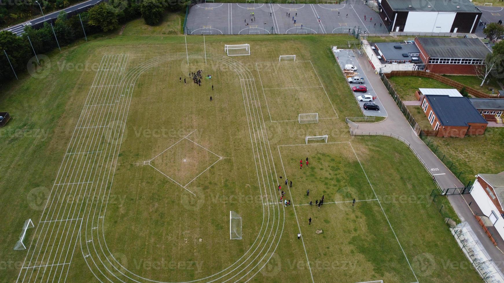 An Aerial Footage and High Angle view of Play Ground of a High School of boys at Luton Town of England, British Motorways and Highways photo