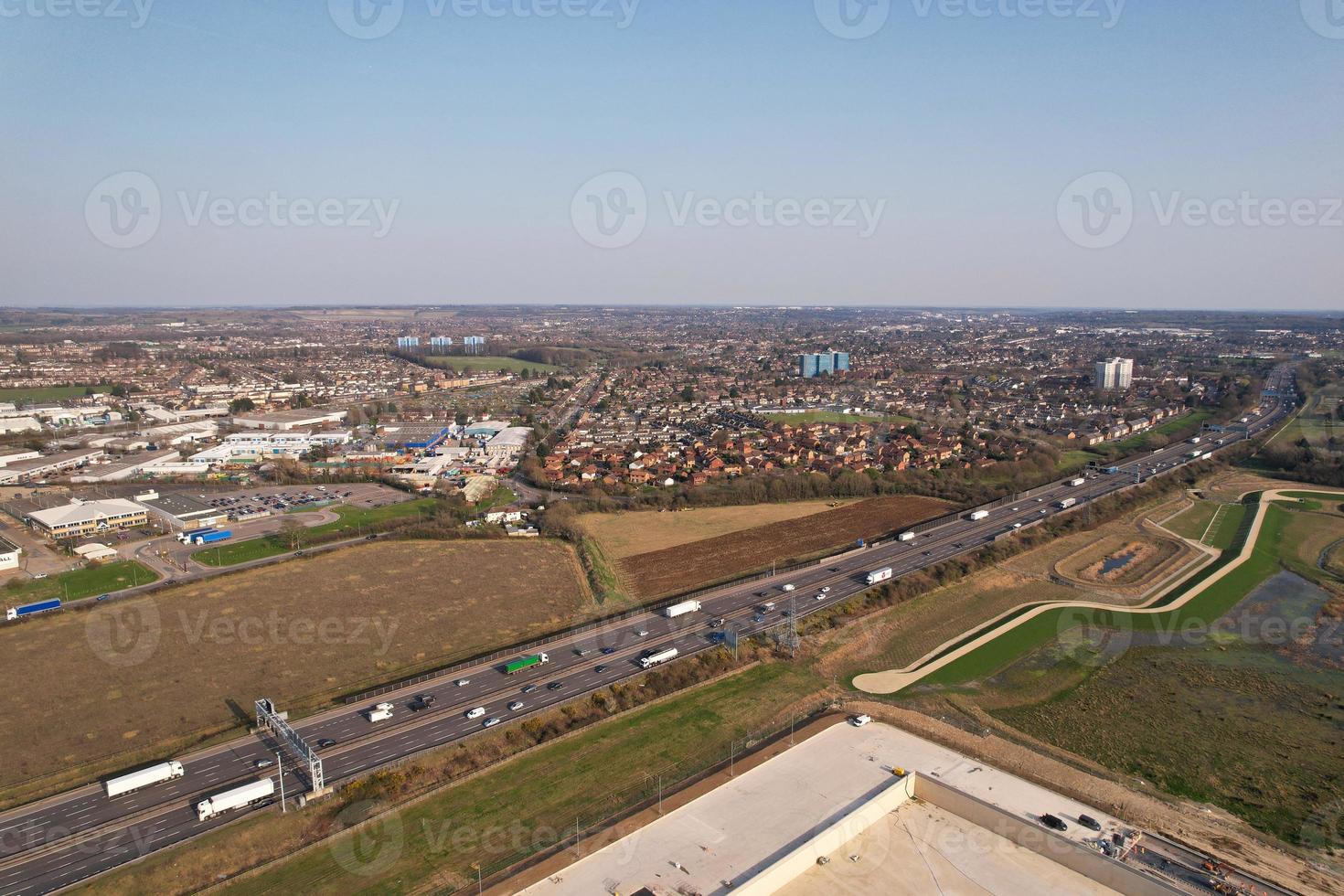 High Angle aerial view of British Roads and Traffic Passing through Luton City and countryside of England UK photo