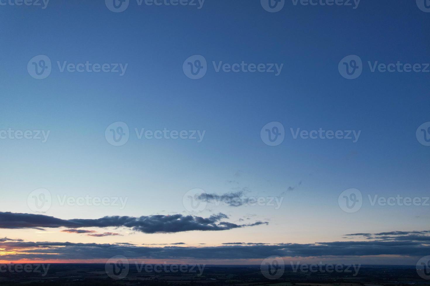 Gorgeous Aerial View of Luton City of England UK at Sunset Time, Colourful Clouds high angle footage taken by drone photo