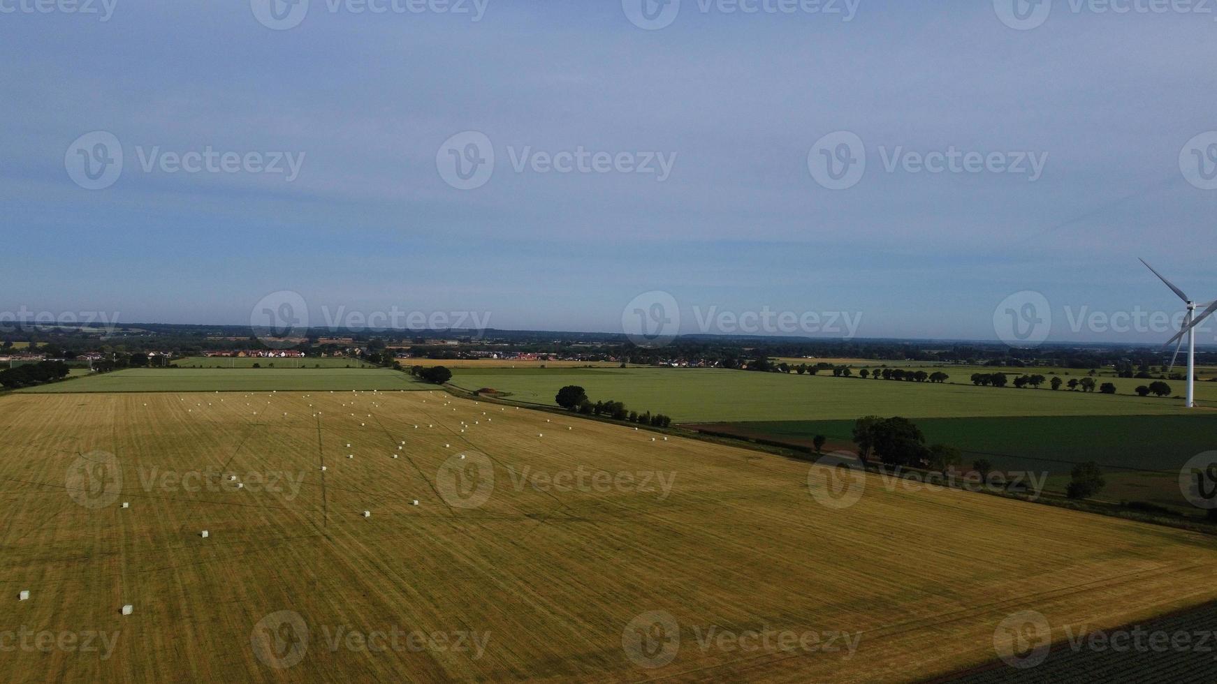 Aerial footage High Angle view of Green Energy natural Generators Sources of Wind turbines and solar panels Farms at England UK photo