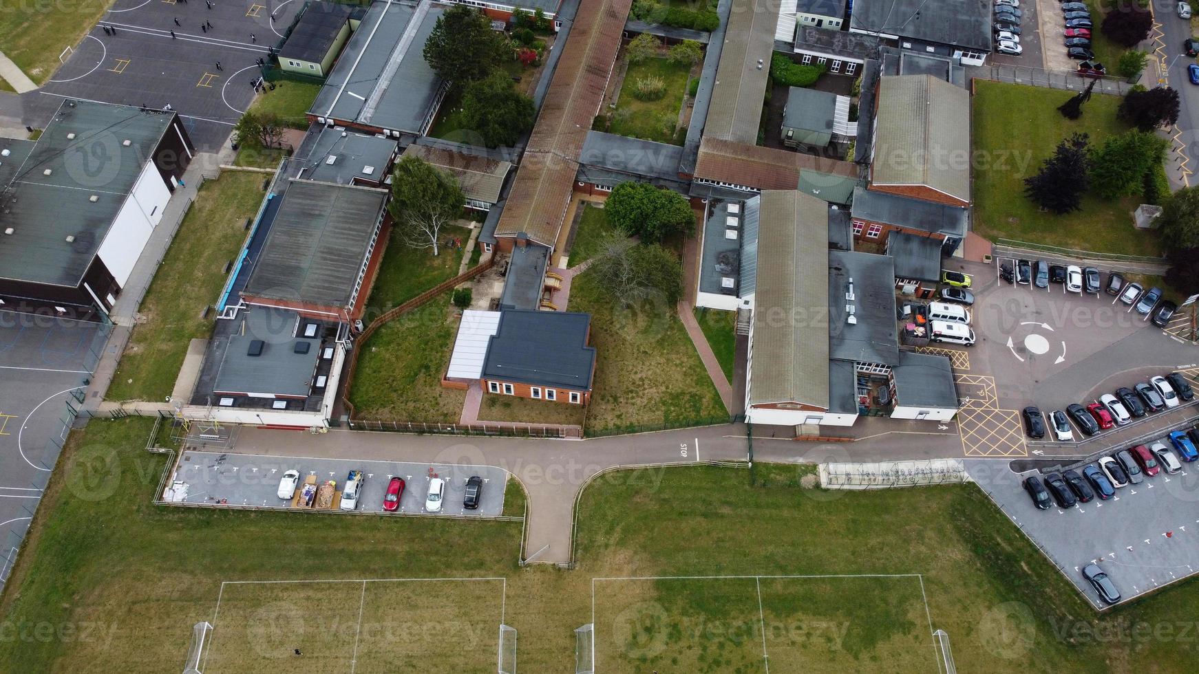 An Aerial Footage and High Angle view of Play Ground of a High School of boys at Luton Town of England, British Motorways and Highways photo