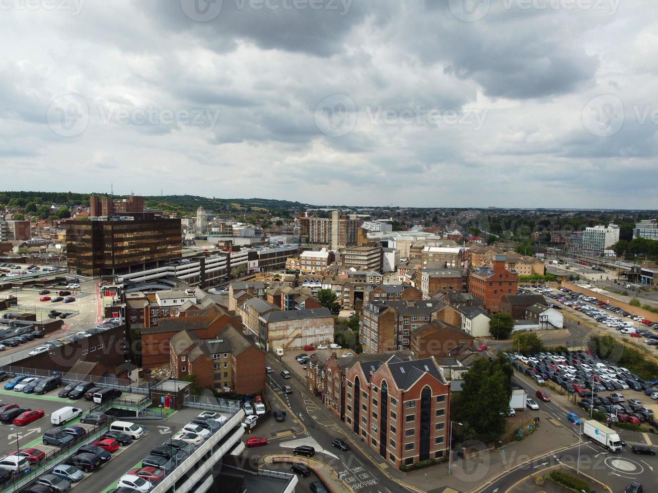 Aerial footage and high angle view of Train on Tracks at Central Luton Railway Station and City Centre of Luton Town of England UK photo