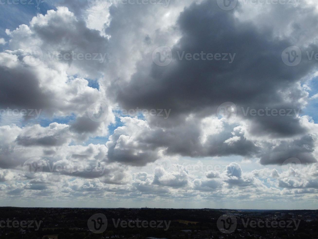 Most Beautiful Sky with Thick Clouds over British Town on a Hot Sunny Day photo