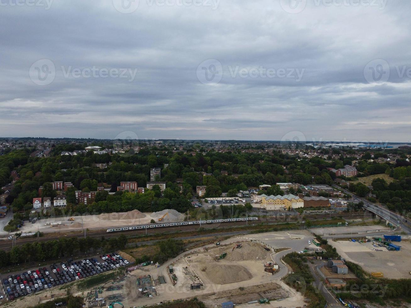 High Angle Footage of London Luton Town and Aerial view of Central Railway Station, Train Tracks of England UK photo