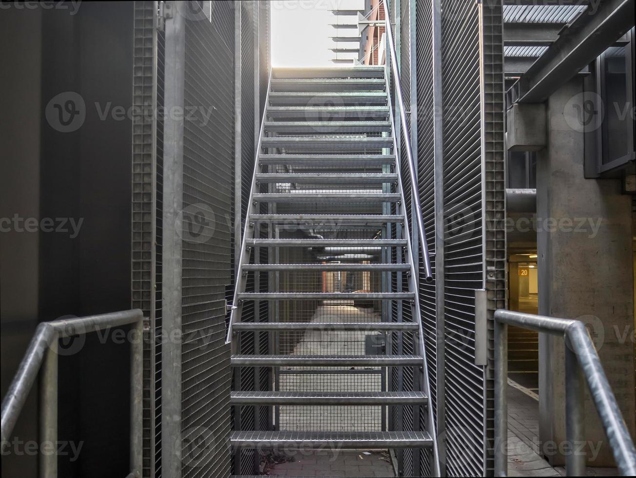 Close up view on metallic stairs at a modern architecture building. photo