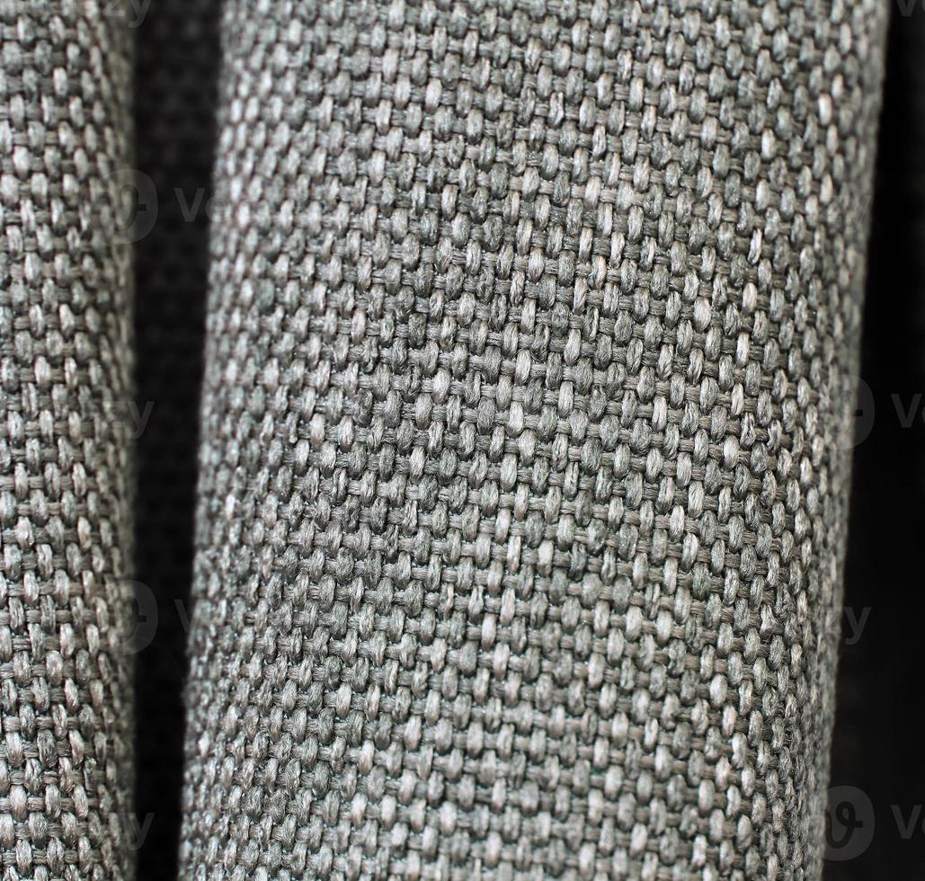Detailed close up view on samples of cloth and fabrics in different colors found at a fabrics market photo