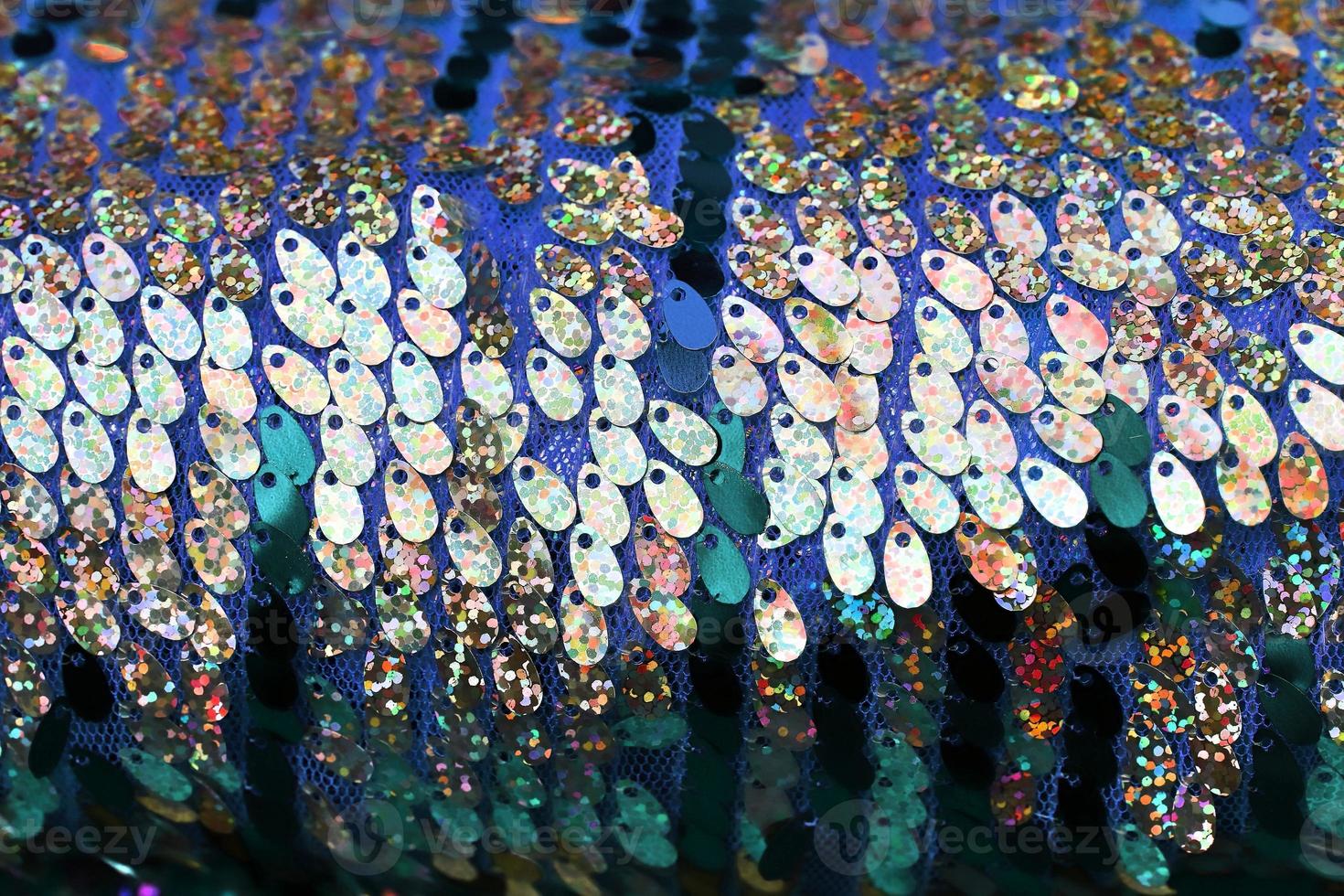Detailed close up view on samples of cloth and fabrics in different colors found at a fabrics market photo