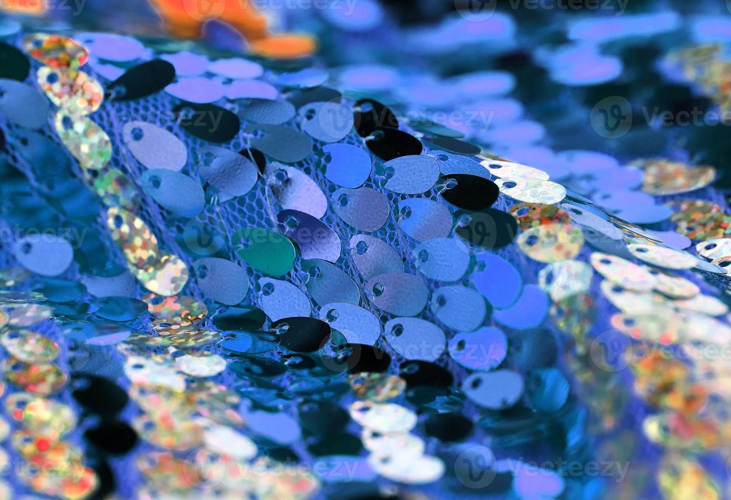 Detailed close up view on samples of cloth and fabrics in different colors found at a fabrics market photo