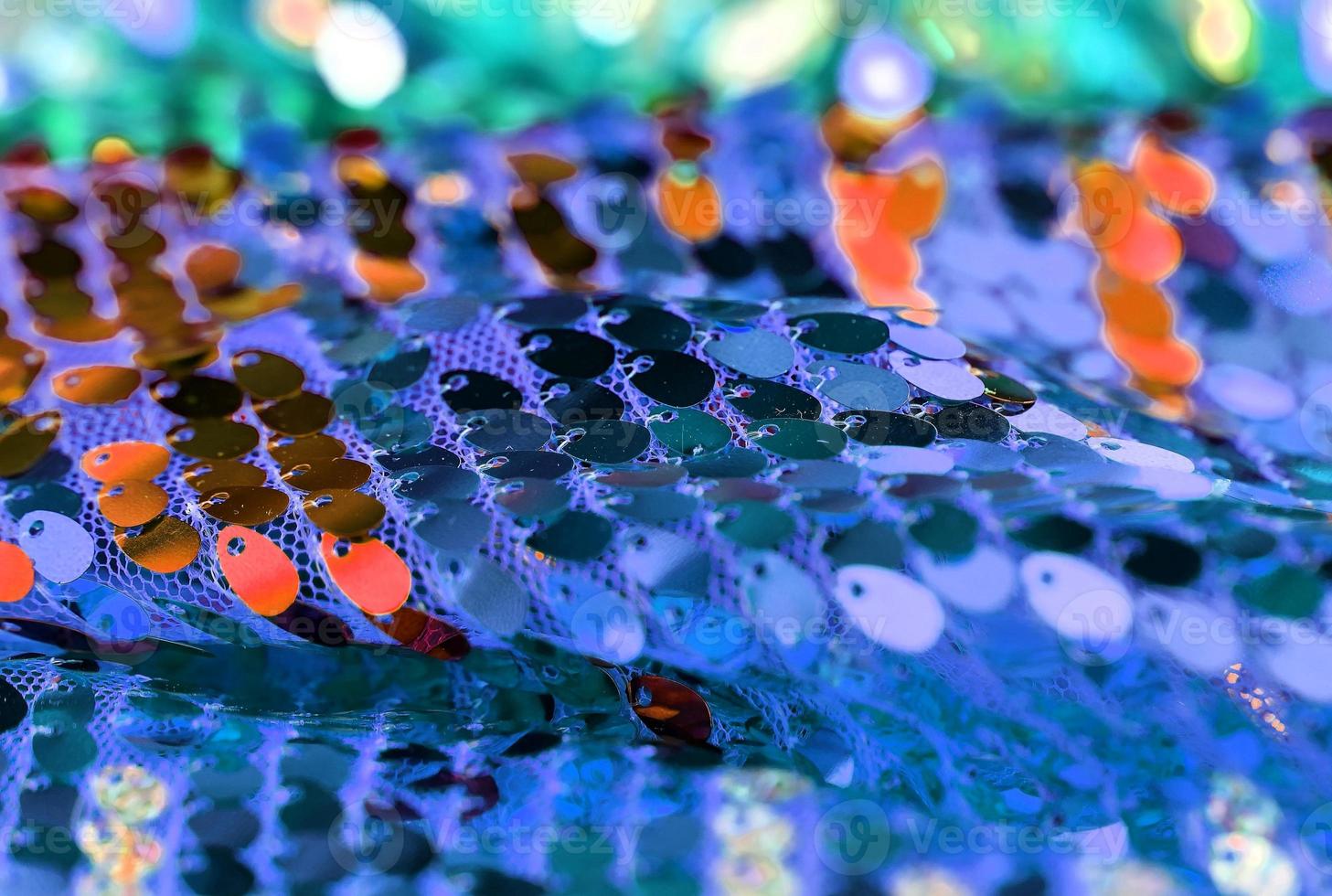 Detailed close up view on samples of cloth and fabrics in different colors found at a fabrics market photo