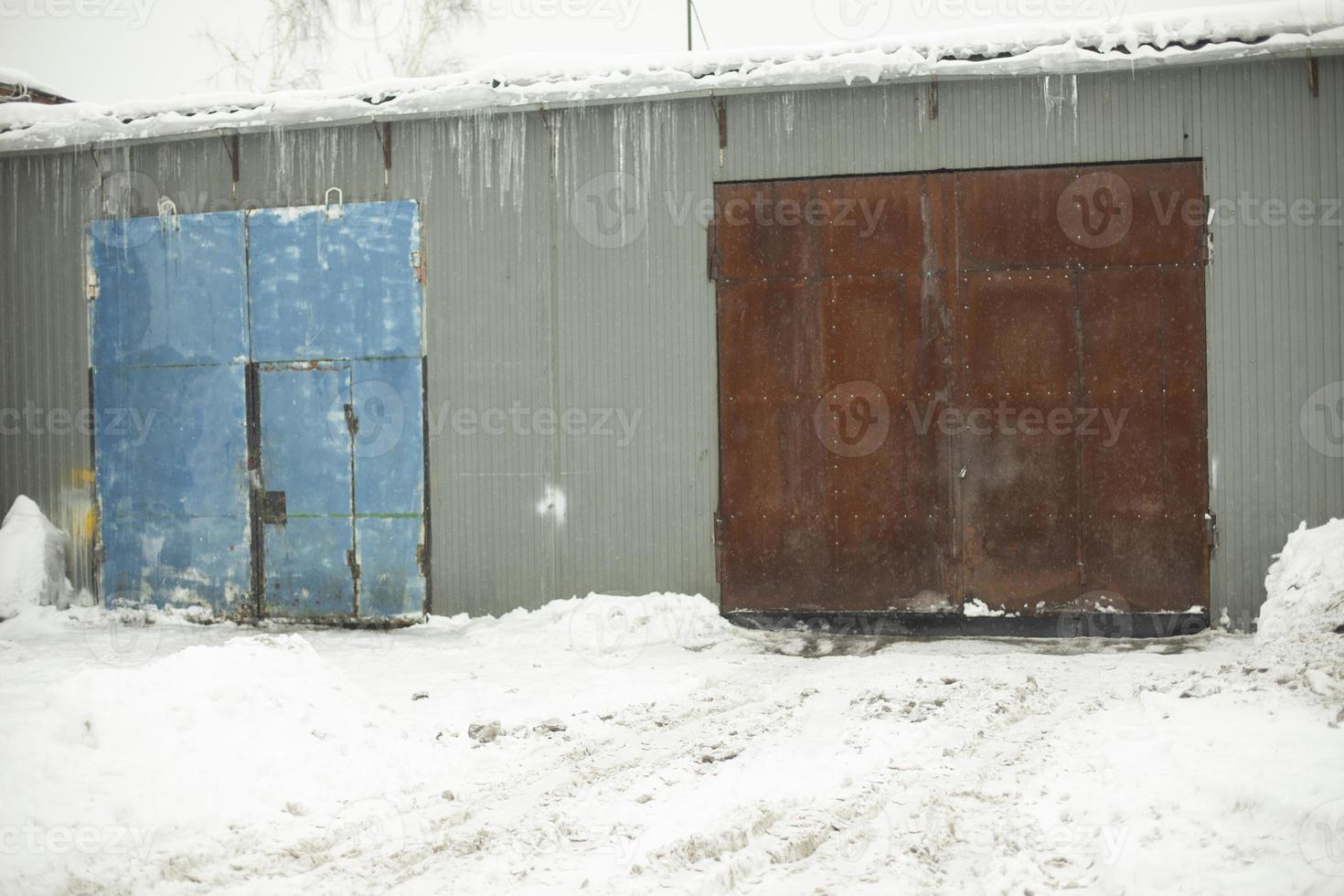 Garage door in winter. Entrance to warehouse. Production room. photo