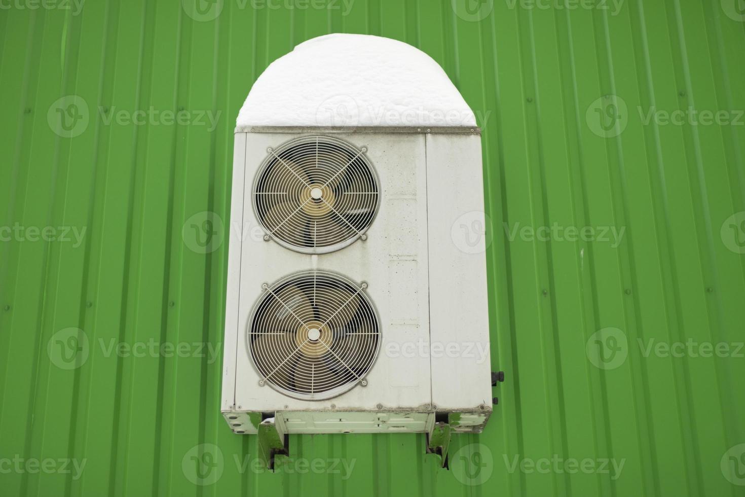 Air conditioning on wall of house. Air conditioner valves. photo